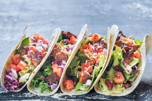 Eating Chipotle Keto: A Low-Carb Lover's Guide 8 Tacos lined up side by side.