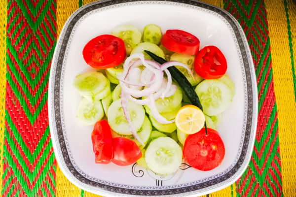 A top-down view of a bowl filled with healthy toppings.