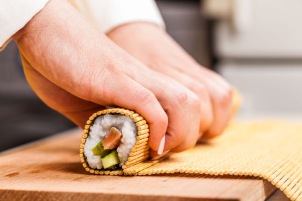 Keto Sushi Rolls: The Perfect Low Carb Meal 9 Rolling the sushi with bamboo mat.
