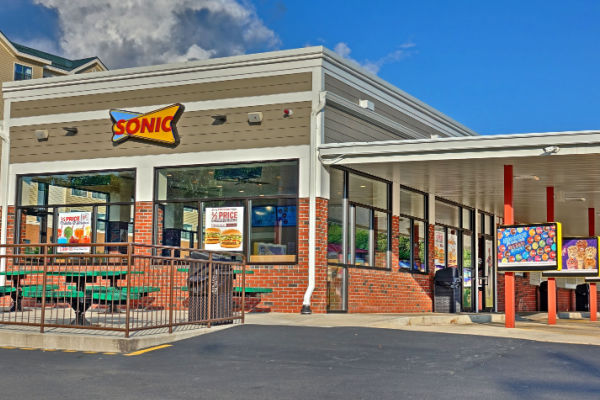 An outdoor perspective view of Sonic Fastfood restaurant.