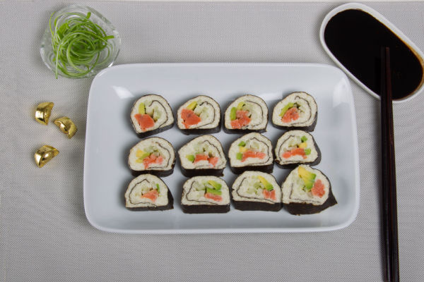 Keto Sushi Rolls: The Perfect Low Carb Meal 5 Sushi roll on plate with soy sauce.