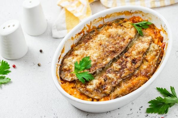 Keto Eggplant Parmesan on a ceramic dish topped with parsley