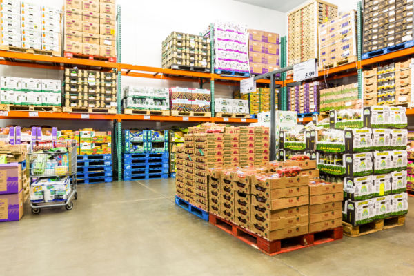 A photo of the interior of a Costco warehouse, showing rows of merchandise and product displays.