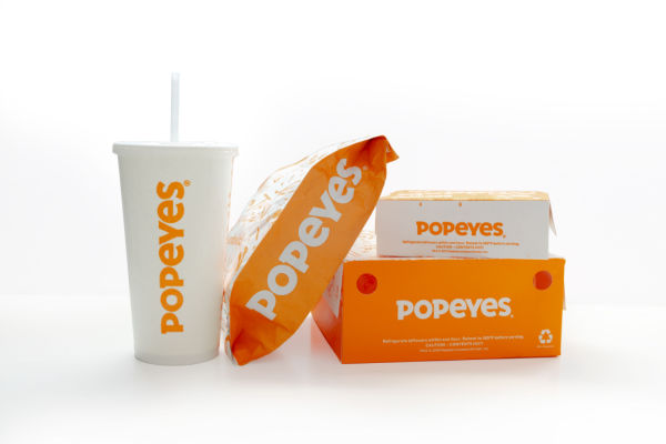 Photo of Popeyes meal boxes and drinks.