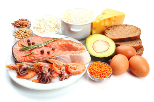 A photo of a variety of foods that are good sources of healthy fats, including avocados, nuts, seeds, and fatty fish such as salmon.