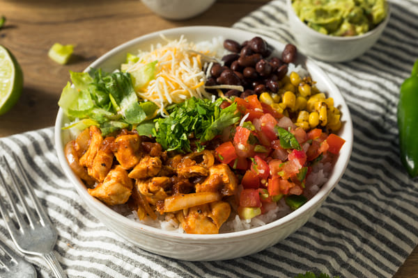 Keto Taco Bell: Enjoy Fast Food Without Breaking Your Diet 4 Chicken burrito bowl with beans, corn, tomato, and rice