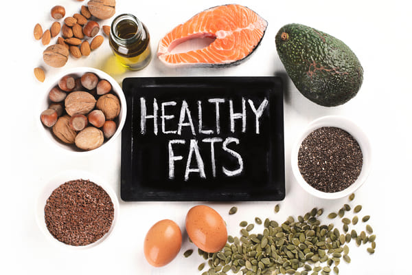 Sources of healthy fats include avocados, eggs, nuts, seeds, olive oil, and fatty fish