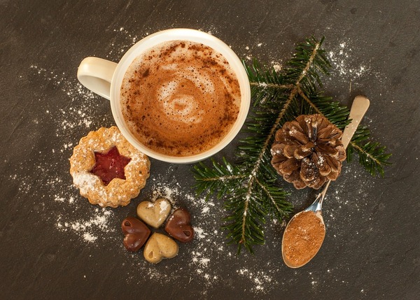 A cup of hot chocolate with cookies