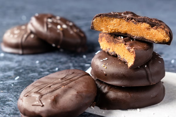 A stack of chocolate-covered peanut butter cookies made with stevia as sweetener
