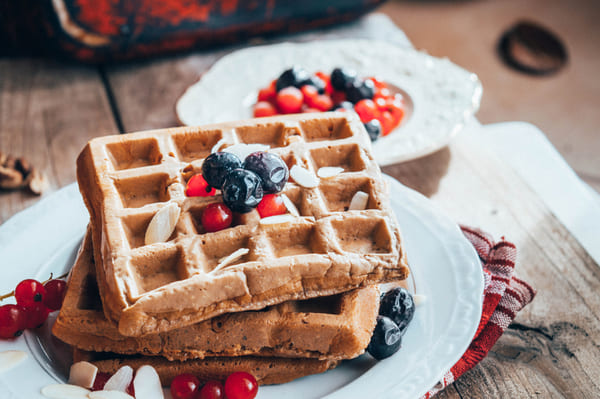 Protein waffles served with berries and sliced almonds