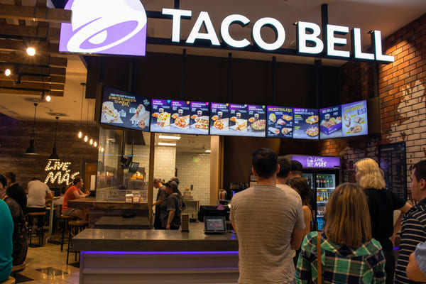 Keto Taco Bell: Enjoy Fast Food Without Breaking Your Diet 8 People in line to order at a Taco Bell restaurant