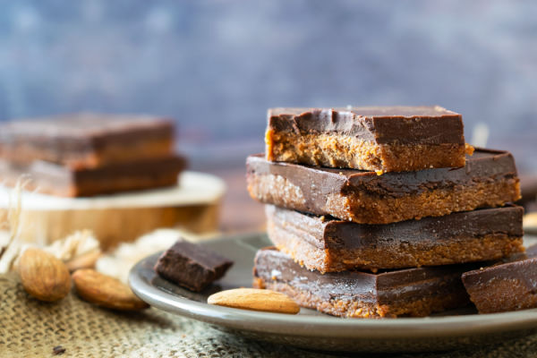 A mouthwatering heap of almond butter fudge, meticulously crafted to perfection.