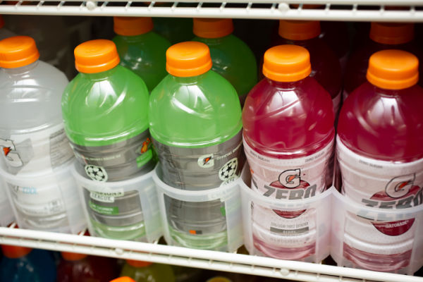 A shelf proudly showcases a colorful array of Gatorade Zero bottles, enticingly arranged and ready to quench your thirst.