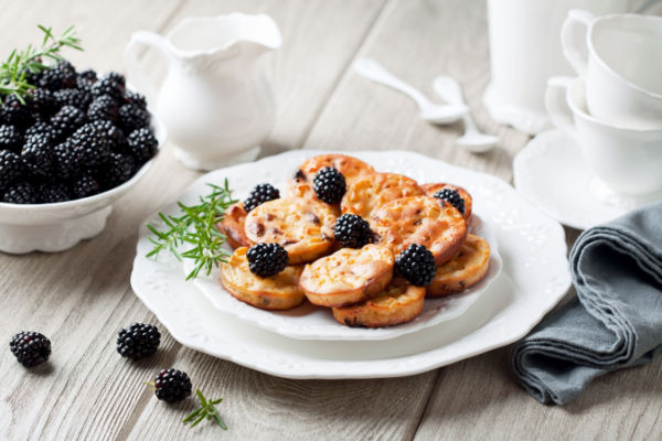 A delectable cookie adorned with a vibrant assortment of fresh berries, beautifully presented on a plate.
