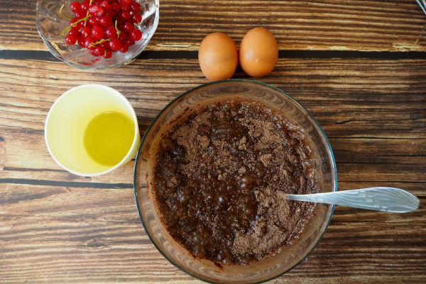 A captivating top-down view of essential baking ingredients: rich chocolate, creamy butter, and fresh eggs.