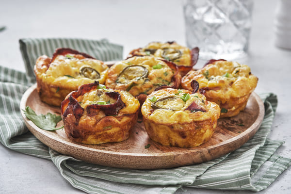 A plate of bacon egg muffins with jalapeno peppers