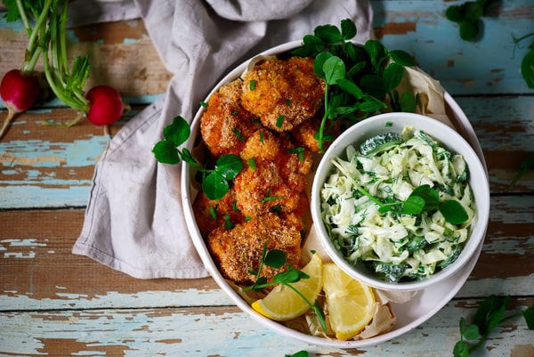 Keto Coleslaw Done Right: Crunchy, Creamy, and Low-Carb! 4 Fried chicken with slices of lemon and a bowl of coleslaw on the side