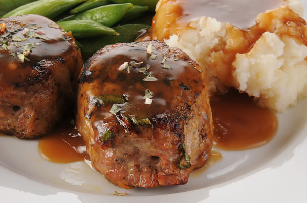 Discover the Perfect Pork Medallions for a Flavorful Feast 2 Pork medallions served with gravy, green beans, and mashed potato