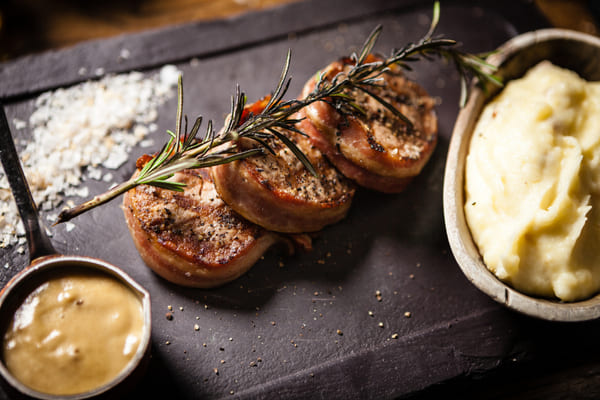 Discover the Perfect Pork Medallions for a Flavorful Feast 7 Pork medallions served with rosemary and gravy with a side of mashed potato