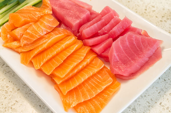 A dish of sliced salmon and tuna fish