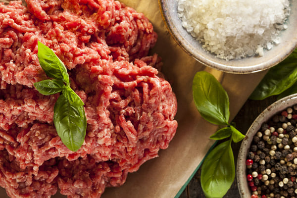 Secrets of Carne Picada: Expert Tips and Techniques 2 Raw ground beef seasoned with a flavorful blend of aromatic spices ready to be cooked into a delicious meal.