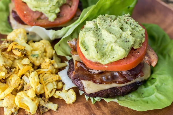 Zaxbys Low Carb: Unveiling the Best Kept Secret 5 A nutritious bunless burger with a variety of healthy options, including fresh lettuce, tomato slices, avocado, and grilled vegetables.