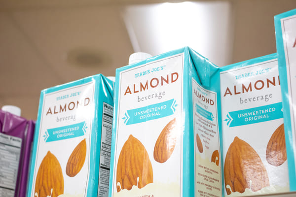 Packaged unsweetened almond milk at a grocery store