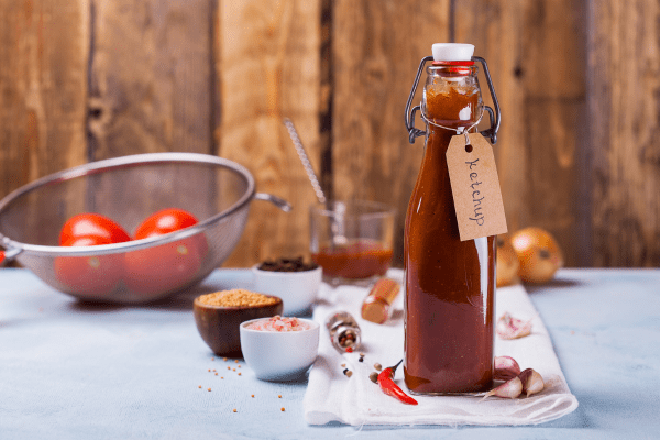 A bottle filled with homemade tomato ketchup, showcasing a flavorful and personal creation.