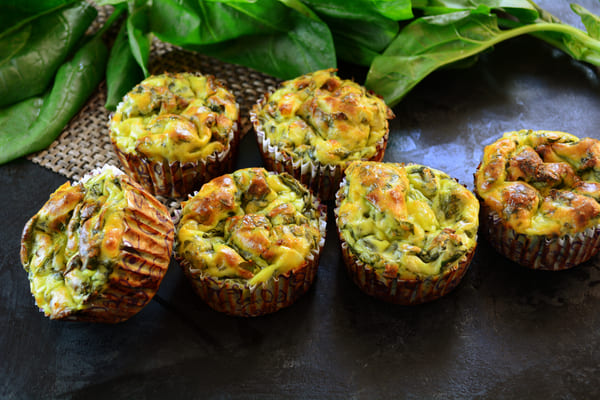 Adorable bite-sized green muffins packed with healthy and nutritious ingredients like spinach, matcha, or green vegetables.