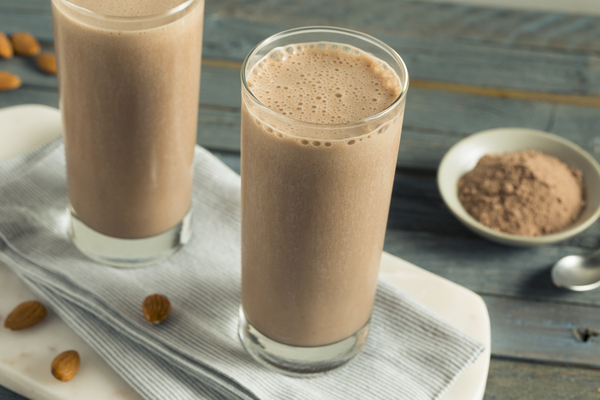 Is Shakeology Keto Friendly? A Comprehensive Guide 6 A glass filled with a protein shake made with almond milk displays a creamy and nutritious beverage.