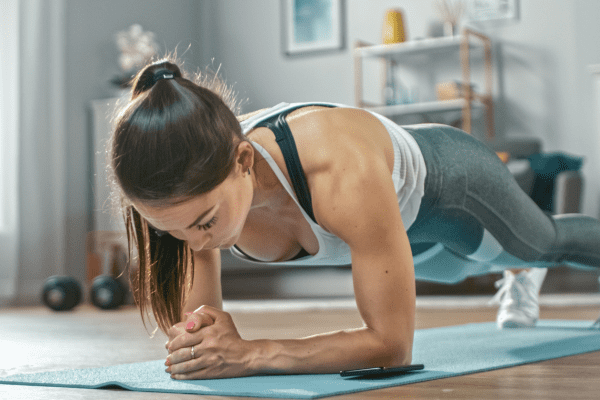 A photo of a woman engaged in exercise, showcasing physical activity and a commitment to fitness.