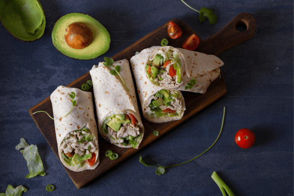 A photo of wraps filled with avocado, showcasing a delicious and creamy ingredient.