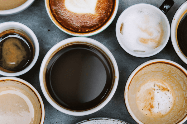A top-down view of a variety of coffee cups, showcasing different types and styles of coffee.