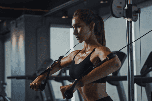A woman working out at the gym.