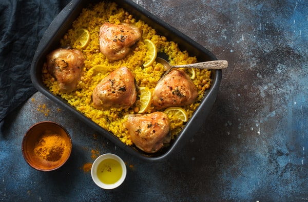 18 Keto Chicken Thigh Recipes: Unleashing Low-Carb Goodness 4 5 pieces of creamy chicken thigh with lemon on top of cauliflower rice