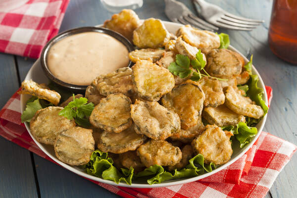 Keto Cook Out Delights: Irresistible Recipes for Your Feast 7 Fried pickles on a bed of lettuce with a sour dip