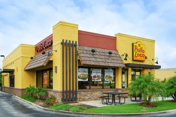 A photo of the exterior of an El Pollo Loco restaurant, featuring their distinctive signage and a visible menu board.