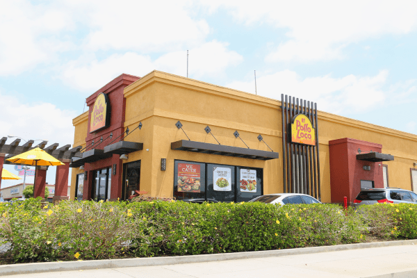 Exterior view of an El Pollo Loco restaurant building, displaying the restaurant's distinctive architecture and signage.