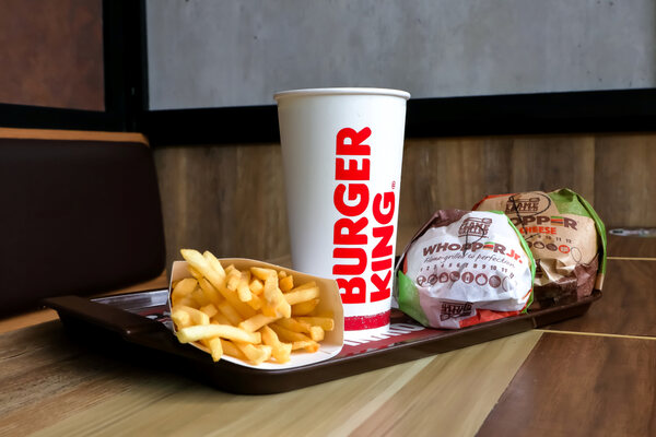Whopper Jr Calories: Eat Smarter and Satisfy Your Craving 5 A Burger King tray with Whopper sandwiches, fries, and drinks