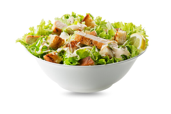 Cheesecake Factory Keto Menu: Indulge Without the Guilt 9 A bowl of Caesar salad with grilled chicken breast and fresh vegetables