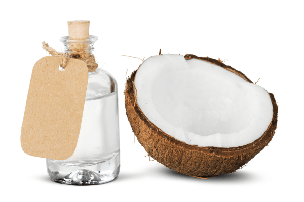 Are Keto Coconut Clusters a Healthy Snack Choice? 5 Half a coconut alongside a bottle of MCT (Medium-Chain Triglyceride) oil, combining natural coconut goodness with a dietary supplement.