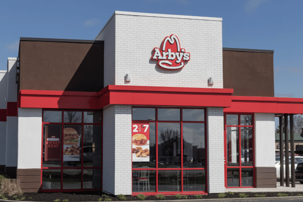 The exterior view of an Arby's restaurant building, featuring its distinctive signage and design, welcoming customers to enjoy its menu offerings.