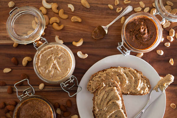 American Dream Nut Butter: Guilt-Free Gourmet Spreads Await 3 Jars of nut butter with peanuts, almonds, and cashews, and toast