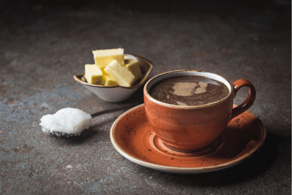 A keto-friendly breakfast featuring Bulletproof coffee, a blend of coffee, grass-fed butter, and MCT oil, known for its high-fat, low-carb composition suitable for ketogenic diets.