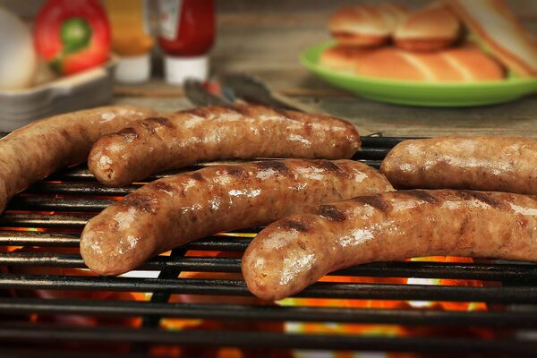 How to Cook Brats in the Oven: Sizzling Techniques Unveiled 8 Grilled bratwurst with buns and sauces in the background
