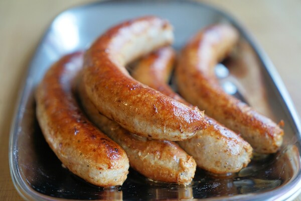 How to Cook Brats in the Oven: Sizzling Techniques Unveiled 2 Cooked bratwurst sausages in a dish