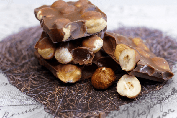 Sugar Free Nutella: Satisfy Your Sweet Tooth Guilt Free 6 A delicious bar of chocolate infused with hazelnuts showcases the perfect harmony of rich chocolate flavor and crunchy hazelnut goodness.
