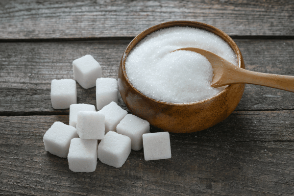 Is Sweet and Low Keto Friendly? What You Need to Know 2 A bowl filled with granulated sugar and sugar cubes, presenting a sweet and versatile ingredient as a representation on whether is sweet and low keto.