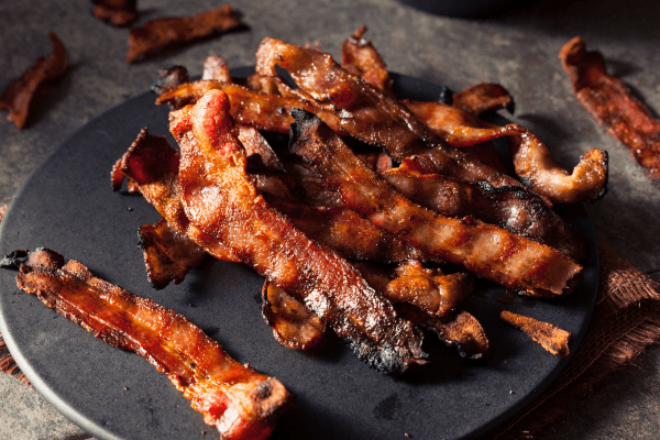 Is Bacon Bad for You? Sorting Myth from Reality 4 Is bacon bad for you: Bacon strips are expertly cooked to a crisp perfection, offering a delightful and savory experience.