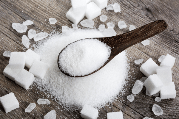 Is Sweet and Low Keto Friendly? What You Need to Know 6 Is Sweet and Low Keto: A spoonful of sugar accompanied by cubes of sugar, offering a visual representation of sweetener options for various culinary uses.